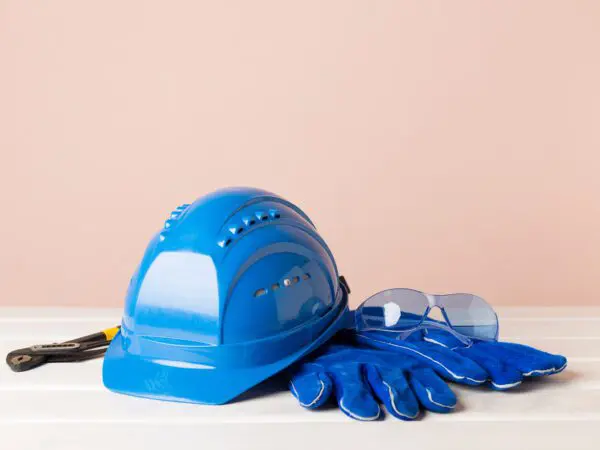 Blue safety gear on a white surface.